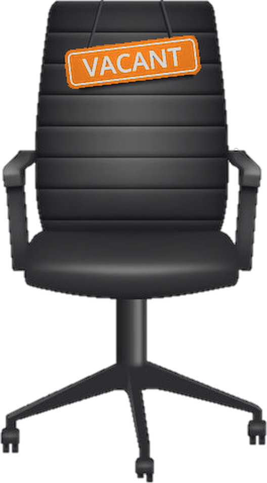 An empty office chair marked vacant, representing an unfilled critical role